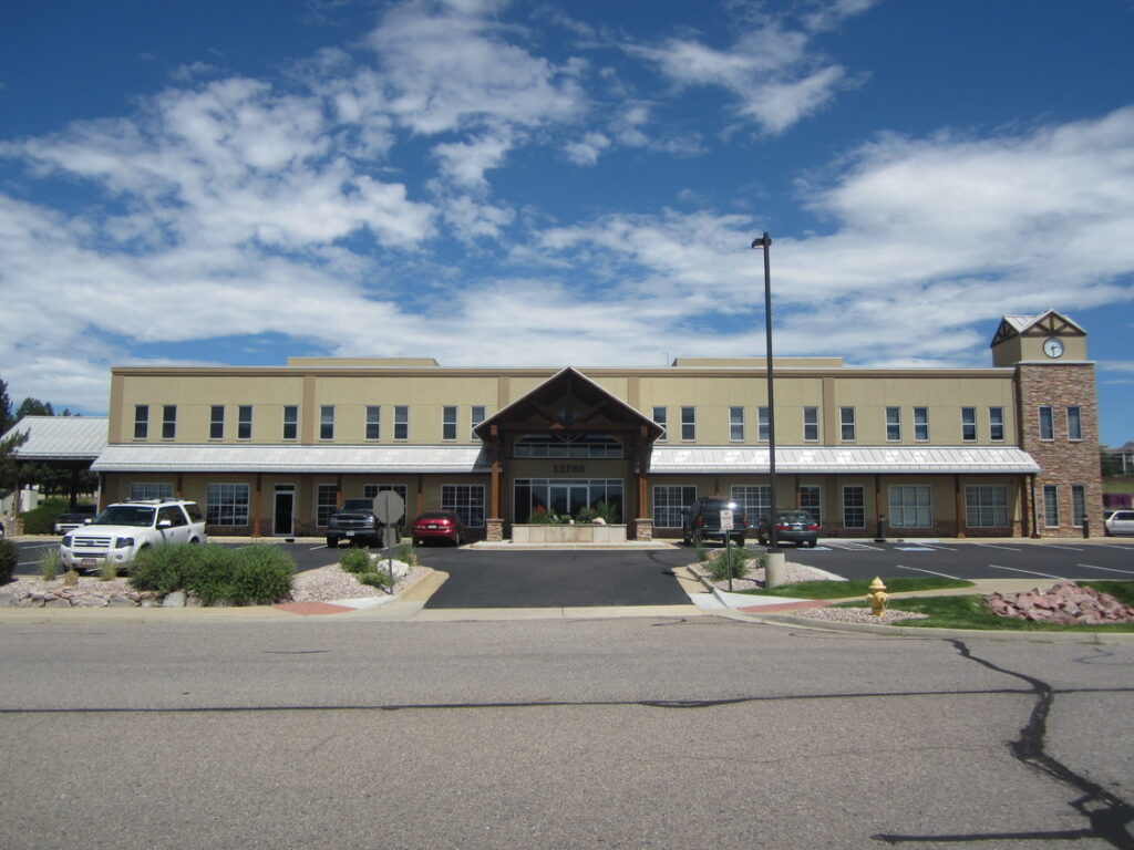 Single-story commercial building with a gabled front entrance
