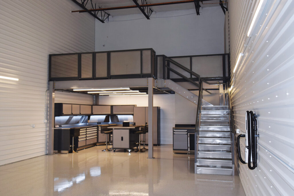 Garage condo mezzanine with kitchenette and steel stairs
