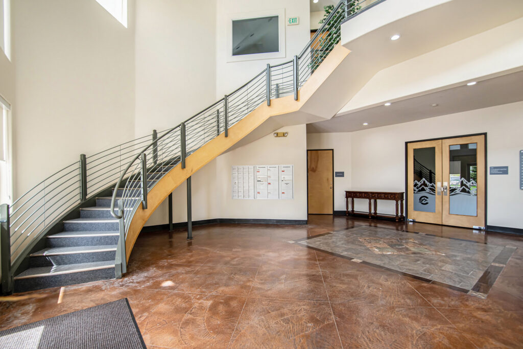 Office lobby with an open staircase and natural light