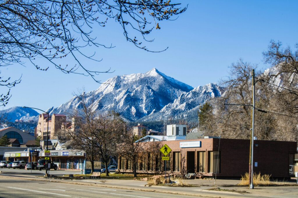 Commercial buildings in Boulder, Colorado with the Flatirons behind